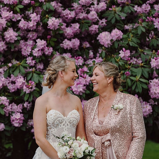 bride posing with mother of the bride