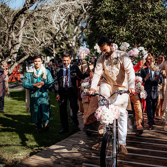 Groom on Bicycle for Baraat Entrance