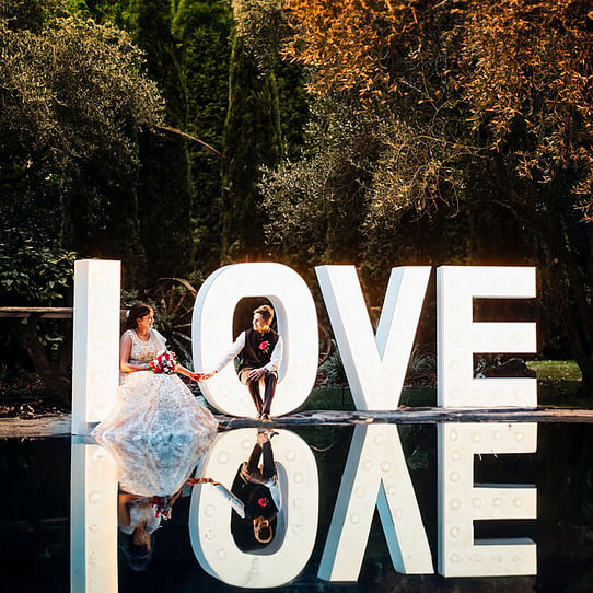 Couple on the LOVE Sign