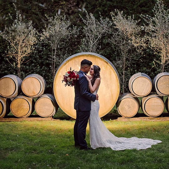 Couple infront of Barrel Feature