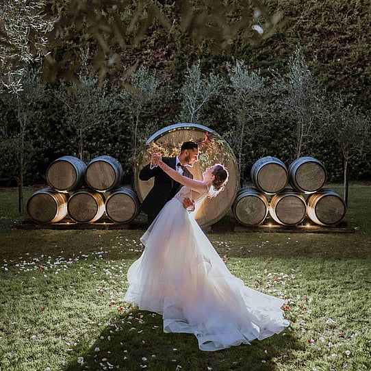 Couple infront of Barrel Feature