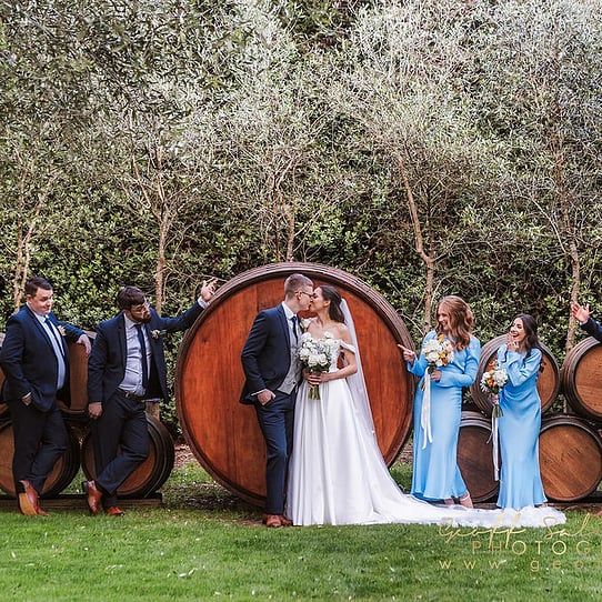 Bridal Party Photo infront of Barrel Feature