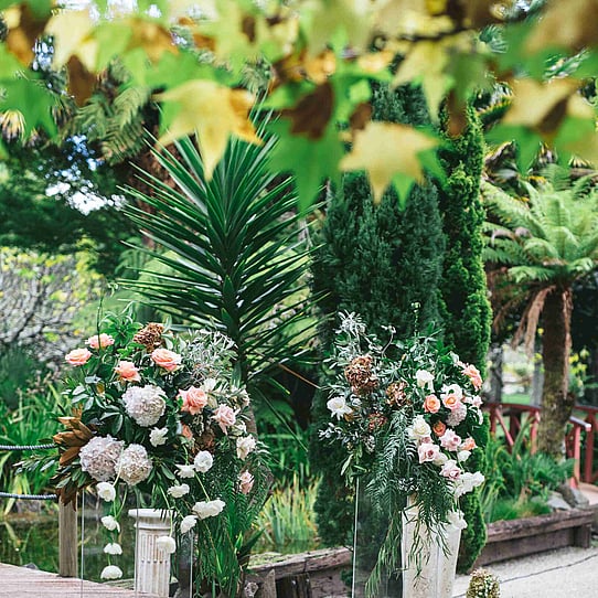 Florals on Plinths at Barrel Waterfall Wedding Ceremony