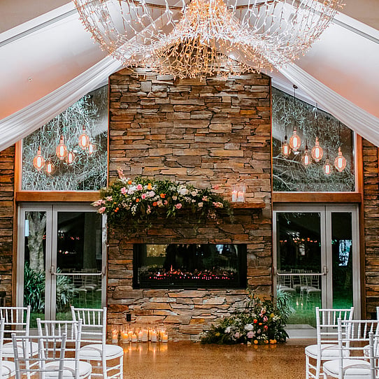 Stone Fireplace Indoor Wedding Ceremony at Night
