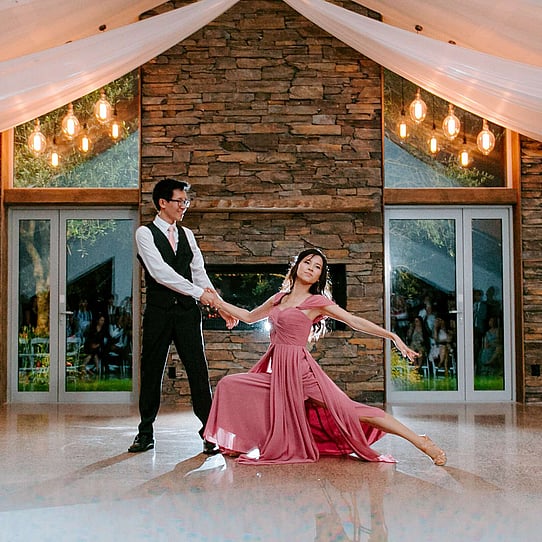 Bride & Groom Dancing infront of the Stone Fireplace