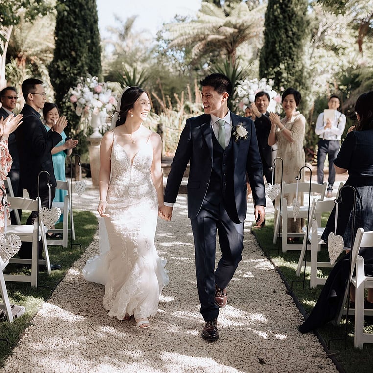 Newlyweds walking up the Aisle