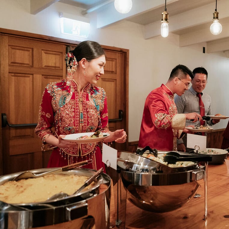 Bride and Groom in Buffet Room wearing Cultural Attire