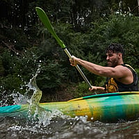 Man kayaks down rapids along Kangaroo River, Kangaroo Valley