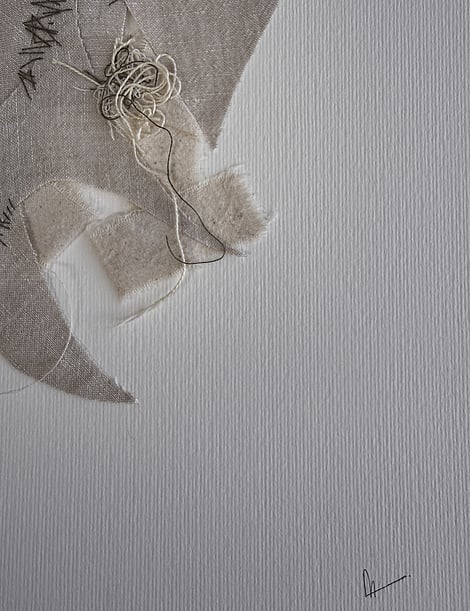 close-up image of ivory fabriano surface texture, layered linen fragments with a messy swirl of thread remnants in the centre, hand-stitched details, visible weave texture, soft frayed edges and handwritten signature in lower right corner