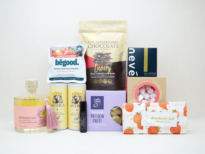 Just For Her Gift Box featuring Anthea Passionfruit Spritz, Neve candle, Botanicals bubble bath, Earthrowe cuticle oil, Strawberry Hill tea towel, Remarkable strawberry pretzel bark, Molly Woppy Passionfruit Cookies, strawberry meringues, and a Be Good protein bar, beautifully packaged for gifting, celebration, and self-care.