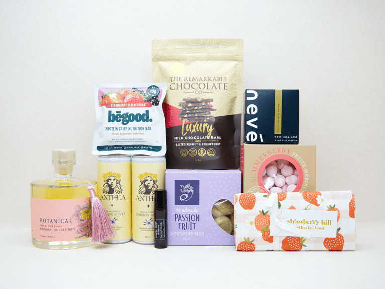 Celebrate The New Mum Gift Box featuring Anthea alcohol-free sparkling wine, Lily & George teddy bear, So Loved baby book, Becca Project candle, Botanicals bath bombs, artisan chocolate, and nourishing treats, beautifully packaged for new mums and new babies.