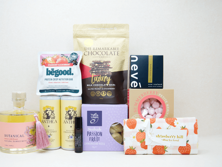 Just For Her Gift Box featuring Anthea Passionfruit Spritz, Neve candle, Botanicals bubble bath, Earthrowe cuticle oil, Strawberry Hill tea towel, Remarkable strawberry pretzel bark, Molly Woppy Passionfruit Cookies, strawberry meringues, and a Be Good protein bar, beautifully packaged for gifting, celebration, and self-care.