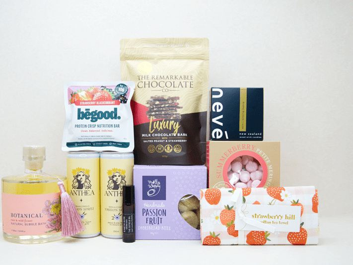 Just For Her Gift Box featuring Anthea Passionfruit Spritz, Neve candle, Botanicals bubble bath, Earthrowe cuticle oil, Strawberry Hill tea towel, Remarkable strawberry pretzel bark, Molly Woppy Passionfruit Cookies, strawberry meringues, and a Be Good protein bar, beautifully packaged for gifting, celebration, and self-care.
