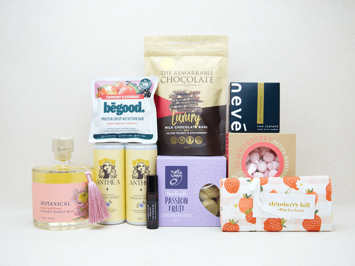 Just For Her Gift Box featuring Anthea Passionfruit Spritz, Neve candle, Botanicals bubble bath, Earthrowe cuticle oil, Strawberry Hill tea towel, Remarkable strawberry pretzel bark, Molly Woppy Passionfruit Cookies, strawberry meringues, and a Be Good protein bar, beautifully packaged for gifting, celebration, and self-care.