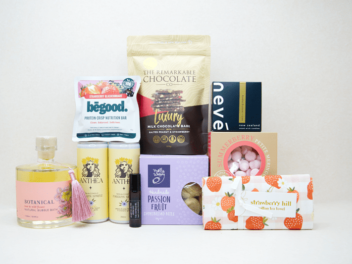 Just For Her Gift Box featuring Anthea Passionfruit Spritz, Nevé candle, Botanicals bubble bath, Earthrowe cuticle oil, Strawberry Hill tea towel, Remarkable strawberry pretzel bark, Molly Woppy Passionfruit Cookies, strawberry meringues, and a Be Good protein bar, beautifully packaged for gifting, celebration, and self-care.