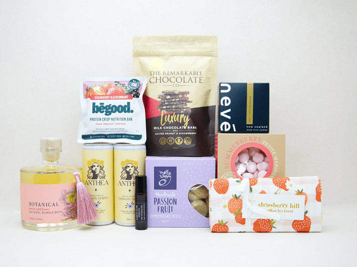 Just For Her Gift Box featuring Anthea Passionfruit Spritz, Nevé candle, Botanicals bubble bath, Earthrowe cuticle oil, Strawberry Hill tea towel, Remarkable strawberry pretzel bark, Molly Woppy Passionfruit Cookies, strawberry meringues, and a Be Good protein bar, beautifully packaged for gifting, celebration, and self-care.