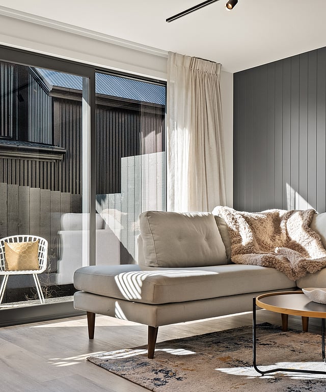 Image of a sun drenched lounge in a Highgate Ridge townhouse in Maori Hill by MJW Homes. Dunedin, Otago NZ