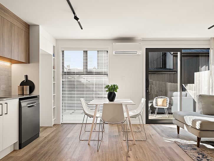 Kitchen and lounge image of Highgate Ridge townhouse in Maori Hill by MJW Homes. Dunedin, Otago NZ Station townhouses by property developer, MJW Homes. Dunedin. Otago. New Zealand.