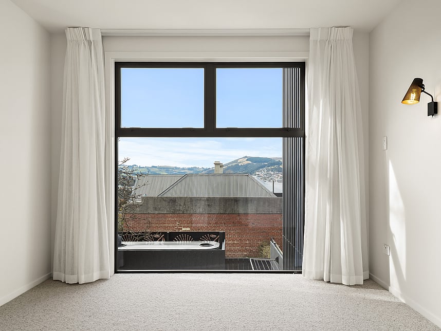 Bedroom interior image of Highgate Ridge townhouses in Maori Hill. Built by MJW Homes. Dunedin, Otago.