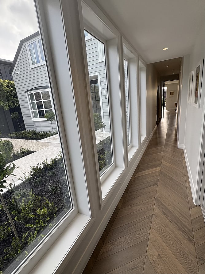 Hallway design - What could be a dark, wasted space has been transformed into a new space in the home that quickly became one of the client's favourite features.