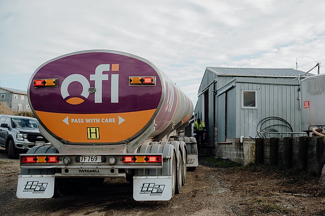 Milk tanker collecting from dairy farm vat