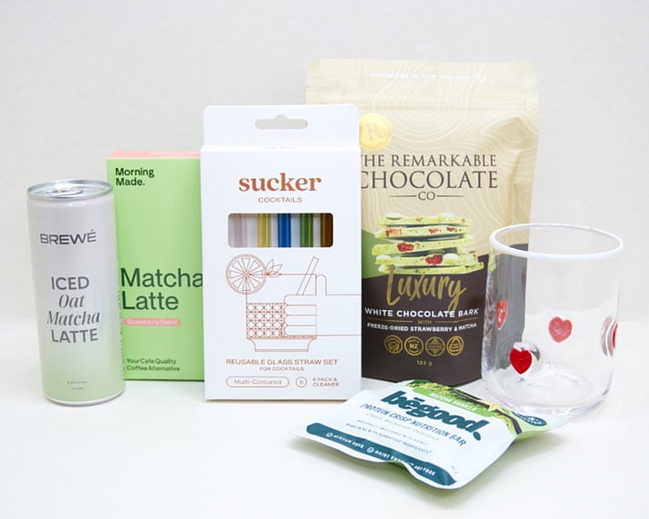 The Matcha Gift Box featuring premium matcha sachets, HomeLab glass, Sucker glass straw, Brewe Matcha Latte, Remarkables Matcha Chocolate, and Be Good Matcha Protein Crisp, thoughtfully curated for matcha lovers and wellness gifting.