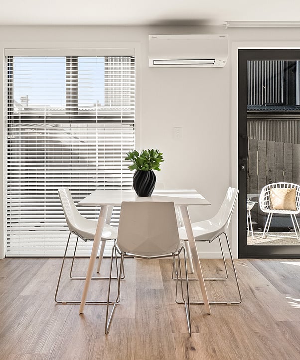 Image of sunlit lounge with views at Highridge Gate townhouse collection at Maori Hill by MJW Homes. Dunedin, Otago.