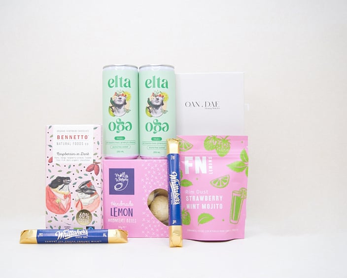 A Gentle Wish Gift Box featuring an OAN DAE Floating Wish Paper Kit, Elta Ego Alcohol Free Mojitos, Bennetto Raspberry Dark Chocolate, Whittaker's Sante Bars, Molly Woppy Lemon Moments, and FN Strawberry Mint Mojito Lemon Dust, thoughtfully curated for meaningful moments, connection, and making wishes.