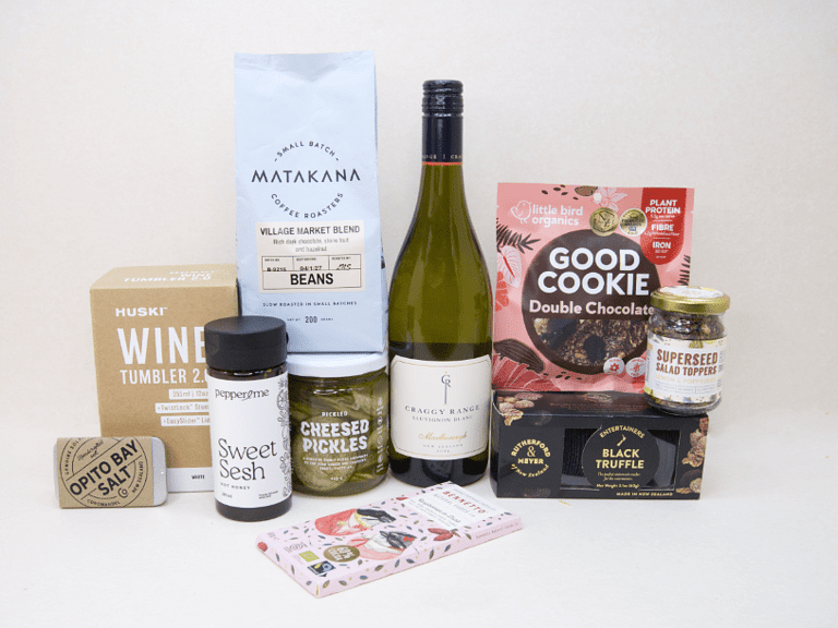 Corporate Gift Hamper featuring Craffy Range Sauvignon Blanc, Matakana Coffee Roasters coffee beans, a HUSKI wine tumbler, Opito Bay salt tin, Bennetto chocolate, PICKLED Sizzled Cucumbers, Rutherford & Meyer Black Truffle Wafer Crackers, a Little Bird Good Cookie, and a Superseed Salad Topper, thoughtfully curated for corporate gifting, client gifts, and settlement gifts.