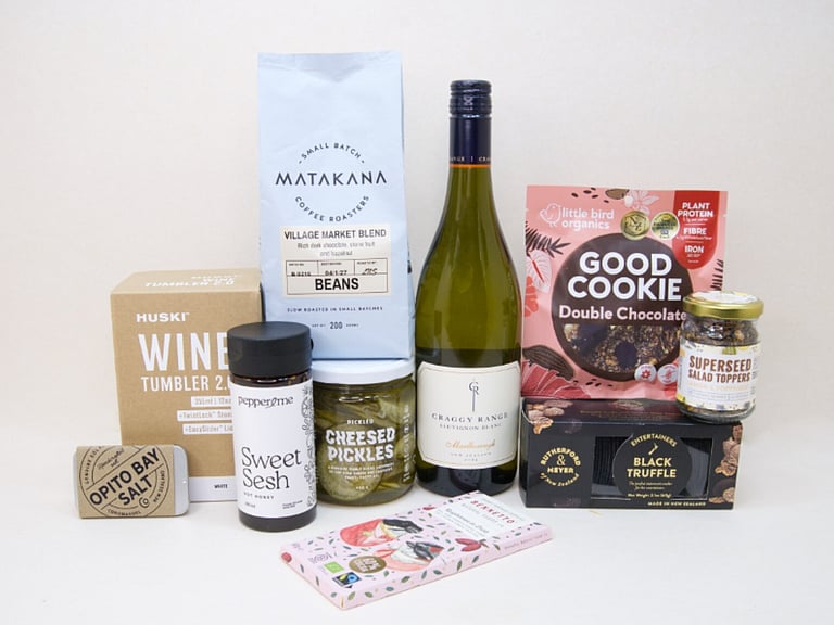 Corporate Gift Hamper featuring Craffy Range Sauvignon Blanc, Matakana Coffee Roasters coffee beans, a HUSKI wine tumbler, Opito Bay salt tin, Bennetto chocolate, PICKLED Sizzled Cucumbers, Rutherford & Meyer Black Truffle Wafer Crackers, a Little Bird Good Cookie, and a Superseed Salad Topper, thoughtfully curated for corporate gifting, client gifts, and settlement gifts.