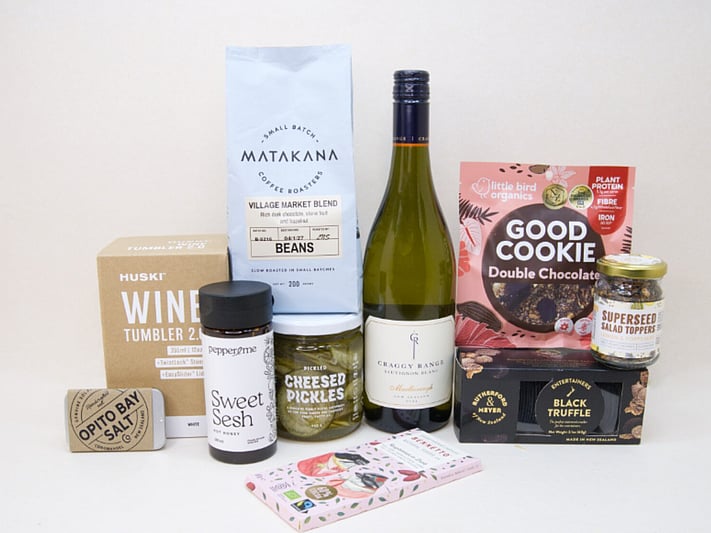 Corporate Gift Hamper featuring Craffy Range Sauvignon Blanc, Matakana Coffee Roasters coffee beans, a HUSKI wine tumbler, Opito Bay salt tin, Bennetto chocolate, PICKLED Sizzled Cucumbers, Rutherford & Meyer Black Truffle Wafer Crackers, a Little Bird Good Cookie, and a Superseed Salad Topper, thoughtfully curated for corporate gifting, client gifts, and settlement gifts.