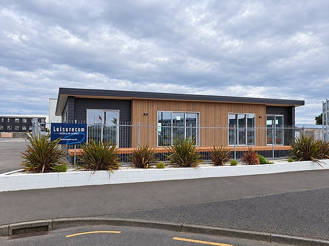 Front of the Napier show home with flax garden and Leisurecom sign