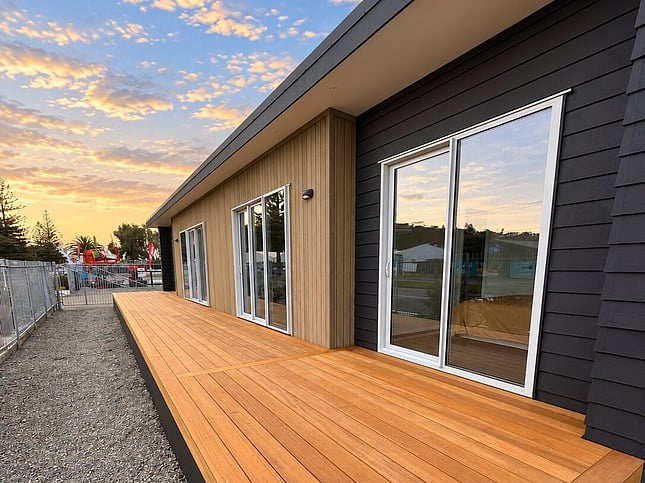 Timber deck along the Napier show home at sunset