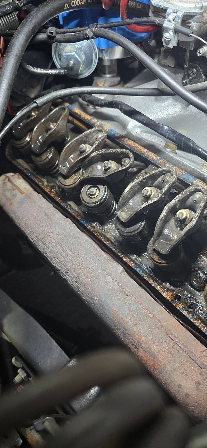 Engine with the rocker cover removed, showing rocker arms and valve springs