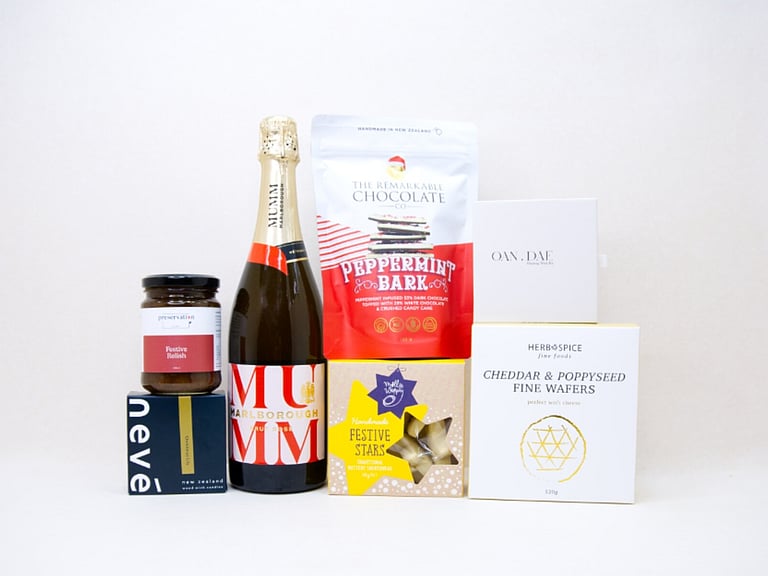 Cheers to Christmas gift box with Mumm sparkling wine, festive treats, candle and Christmas crackers
