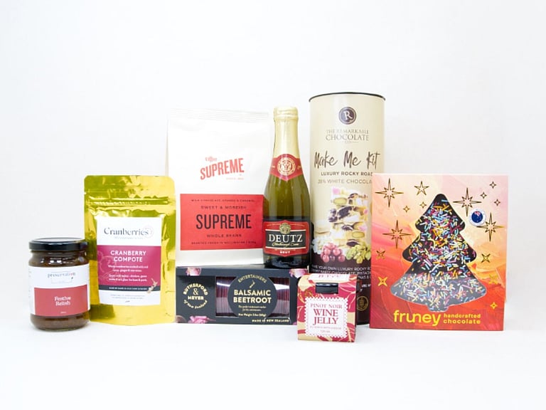 The Festive Table Christmas gift box with sparkling wine, gourmet Christmas treats, crackers, coffee and festive chocolate