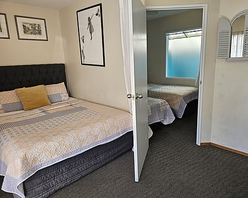 Queen bed plus two single beds, very compact