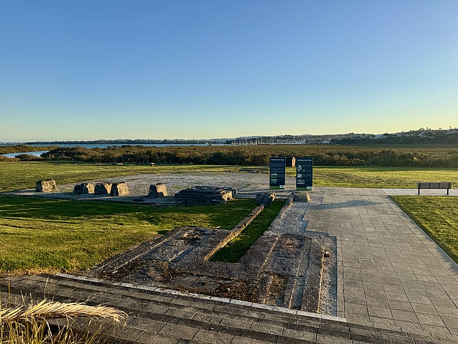 Historic pottery kiln foundations at Limeburners Bay heritage site in Hobsonville, Auckland, at golden hour