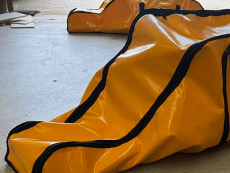 Custom orange PVC rope ladder bag with black binding and carry handles