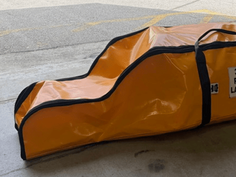 Top view of orange rope ladder bag showing the zip and handles