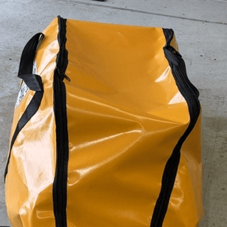 Top view of orange rope ladder bag showing the zip and handles
