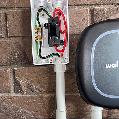 Wall-mounted home EV charger with its own isolator, Cambridge