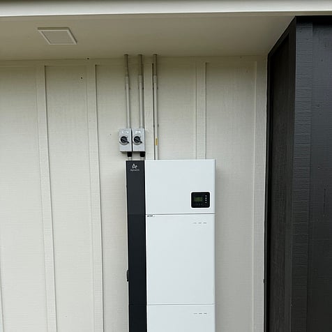 Home battery and inverter stack installed under cover in Featherston