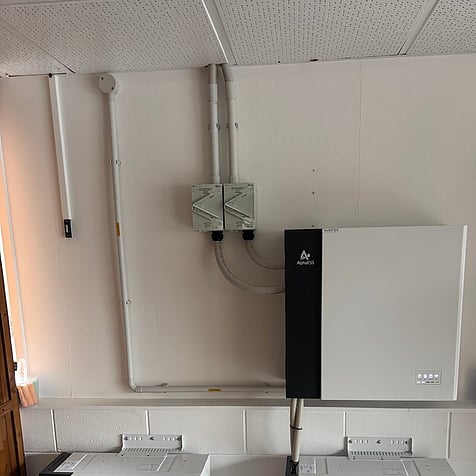 Inverter and battery modules set up in a Rotorua garage
