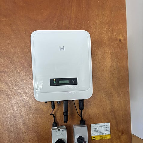 Inverter with DC isolators, neatly mounted in Cambridge