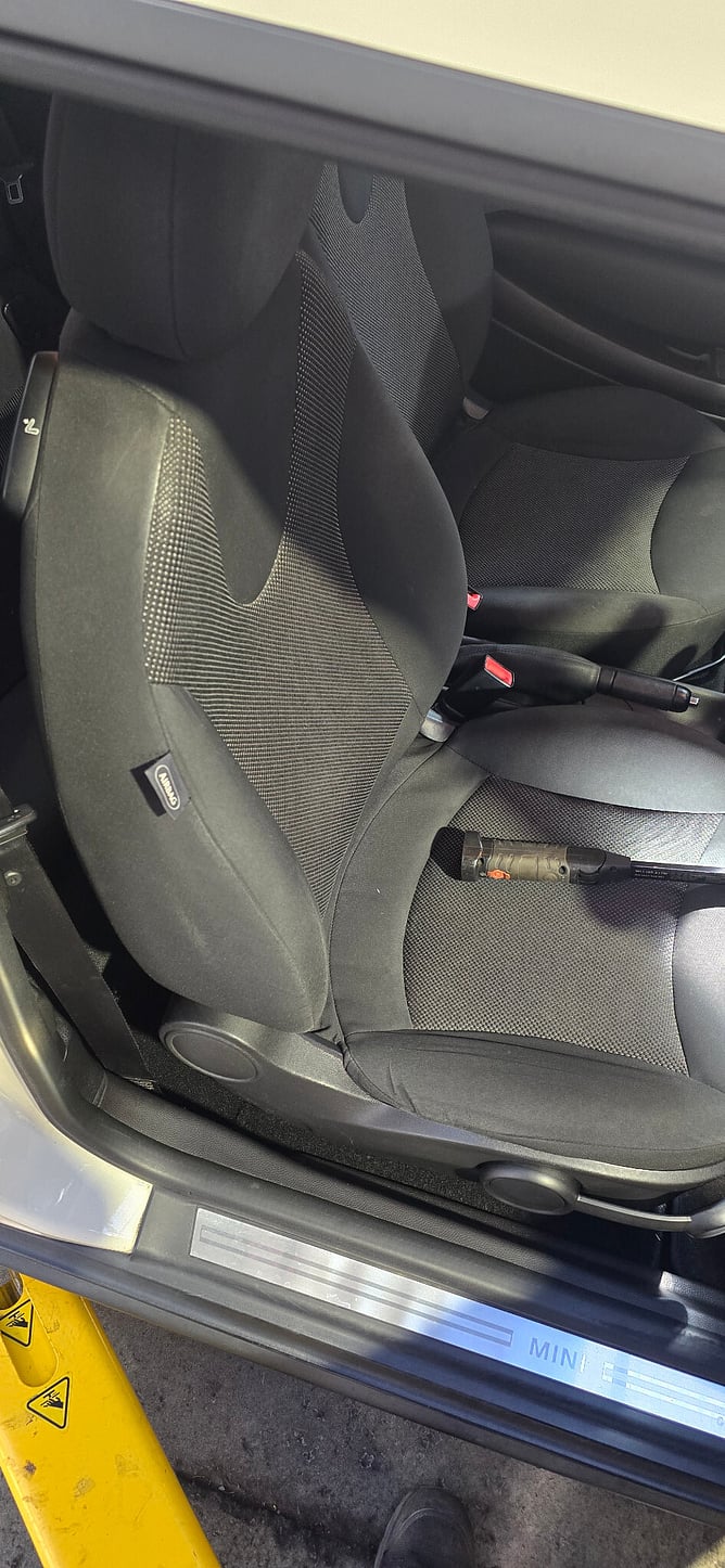 Driver&rsquo;s seat inside the MINI R56 during the workshop inspection.