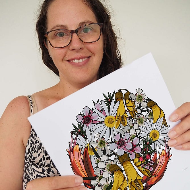 Anna Mollekin holding her My Sunshine floral art print with kōwhai, mānuka and daisies