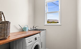 New laundry tub with a timber bench in the Taradale, Napier renovation