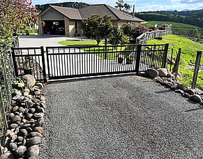 Custom black aluminium driveway gate
