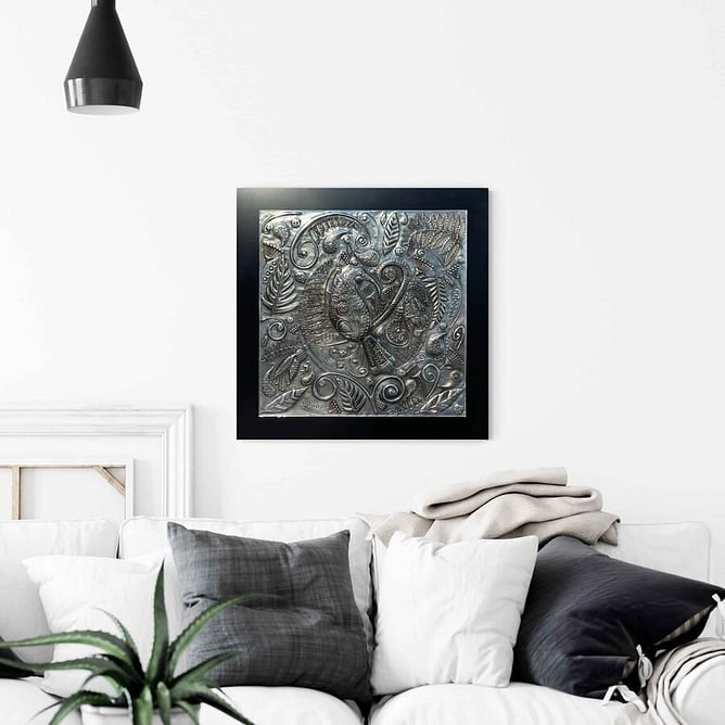 Huia&rsquo;s Lustrous Lacework pewter wall art hanging above a sofa in a living room
